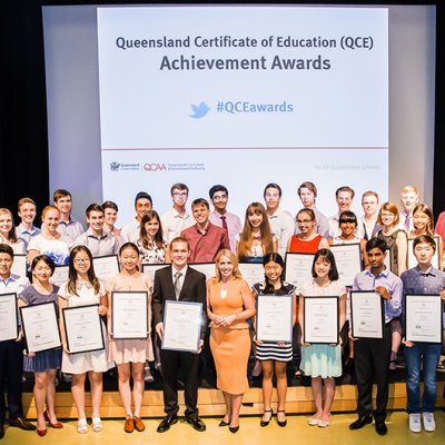 The QCE Achievement Award winners with the Hon Kate Jones (centre) and Brian Short, Chair of the QCAA Board (far left)